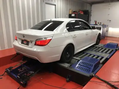BMW 5 Series E60 white — rear view on the dyno, ECU remap Sydney