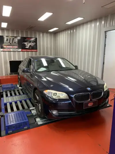 BMW 5 Series navy blue on the DTA Mainline dyno — ECU remap Sydney