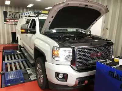 GMC Sierra white with bonnet open on the DTA Mainline dyno — ECU remap Sydney