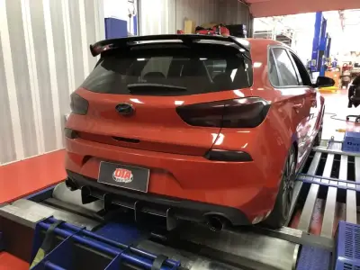 Hyundai i30 N orange — rear 3/4 on the dyno, ECU remap Sydney