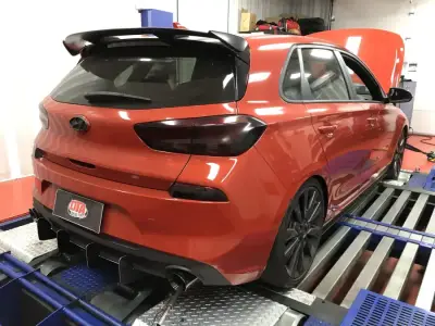 Hyundai Accent 1.6L ECU remap — Hyundai i30 N orange performance hatch — rear view on the DTA dyno, ECU remap