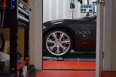 Maserati GranTurismo black — wheel and Pininfarina side detail on the DTA dyno