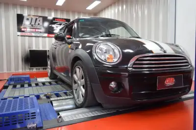 Mini Cooper D R56 black with orange racing stripe on the DTA dyno — ECU remap