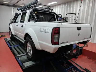 Nissan Navara 2.5L ECU remap — Nissan Navara D22 4×4 Off Road, white — rear view after ECU remap