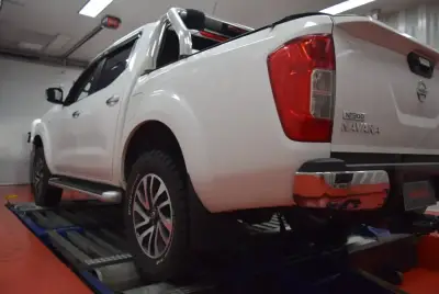 Nissan Dualis 1.6L ECU remap — Nissan NP300 Navara rear — dyno strap fitted for tuning run