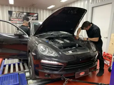 Porsche Cayenne 3L ECU remap — Porsche Cayenne 958 black — bonnet open during ECU remap at DTA Sydney