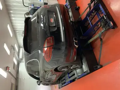 Porsche Cayenne 958 dark grey — rear view on the DTA Mainline dyno, ECU remap