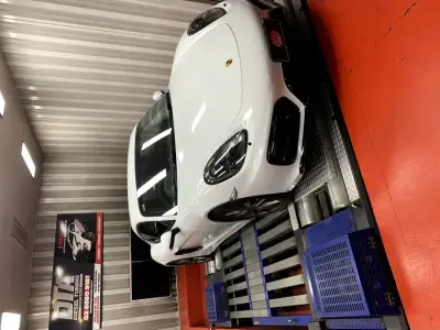 Porsche Cayman 981 white — front 3/4 on the DTA Mainline dyno, ECU remap Sydney