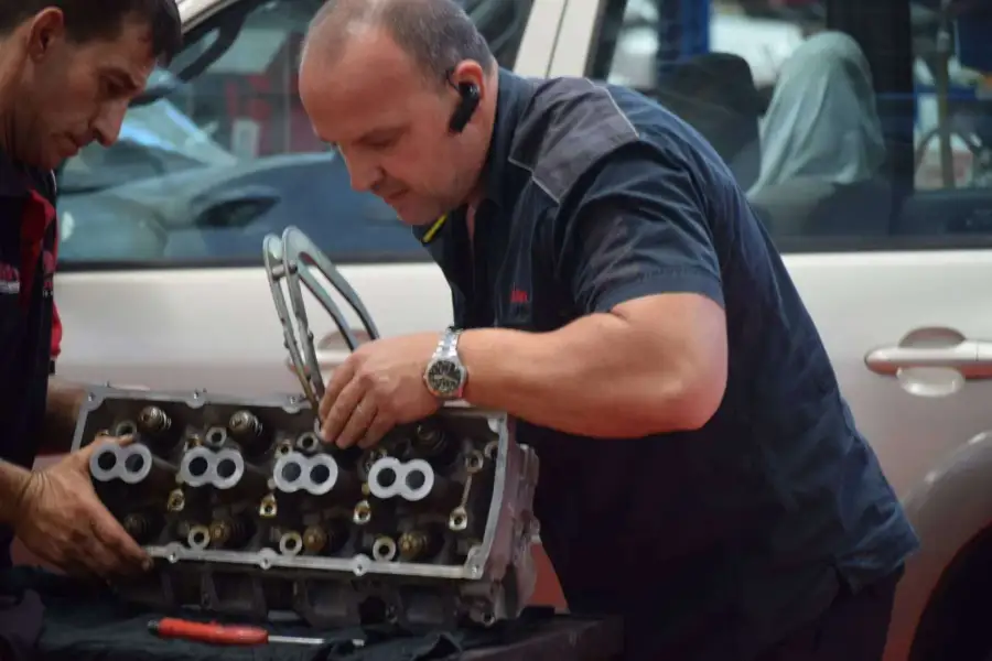 Diesel mechanic working on an engine repair